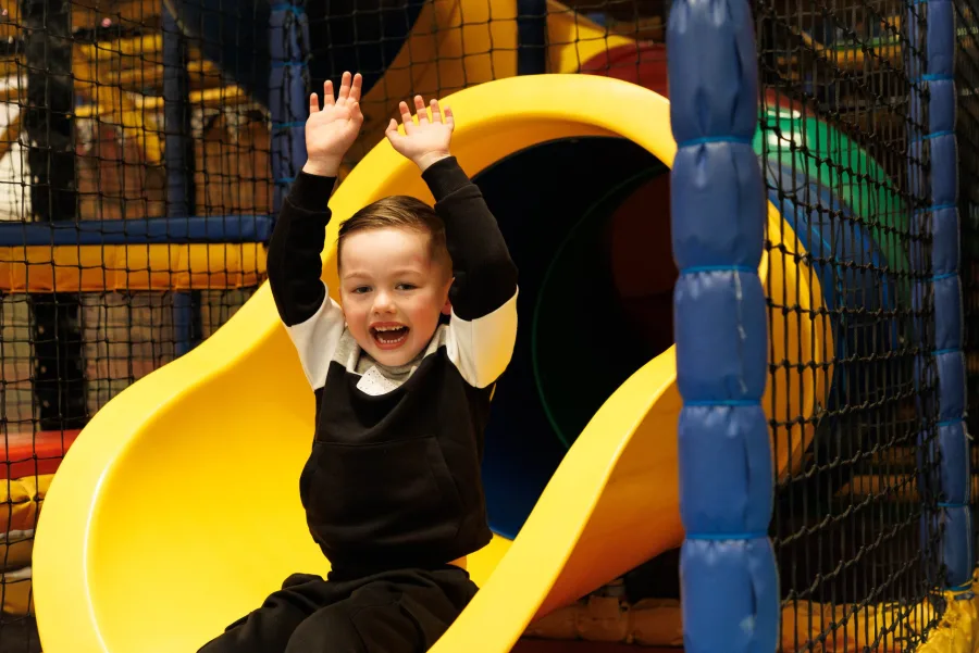 Child sliding inside Wonder World Glasgow